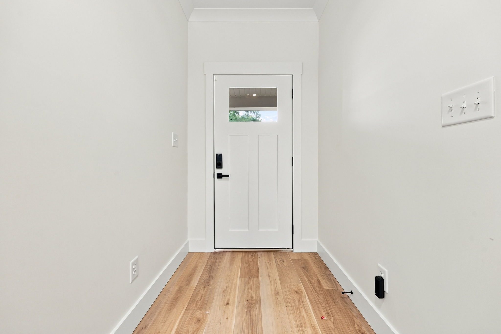 Bright Entry Hall at The Eliora by Covenant Construction Group