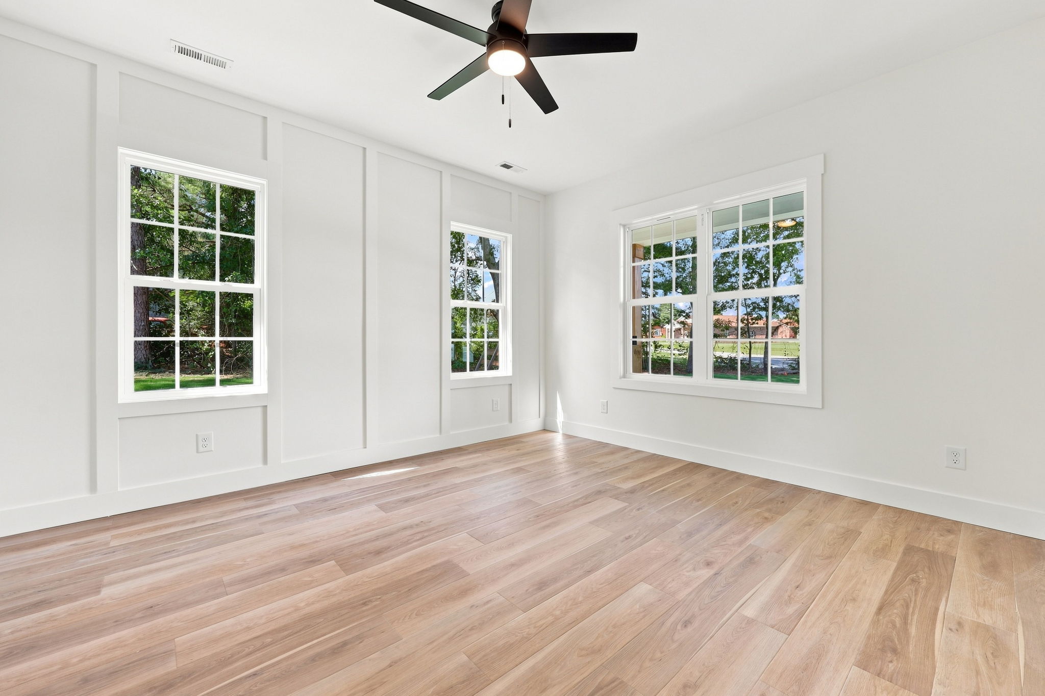 Light-Filled Flex Room at The Eliora by Covenant Construction Group