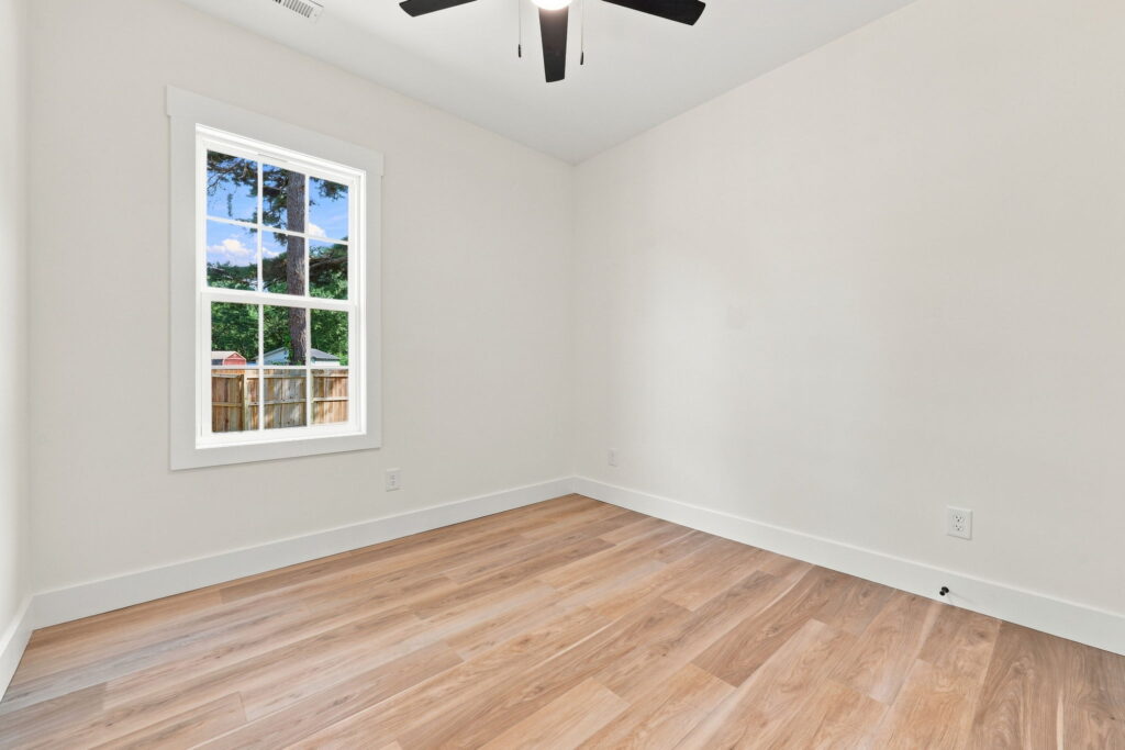 Bedroom 3 — Neutral finishes and a window positioned for flexible furniture placement