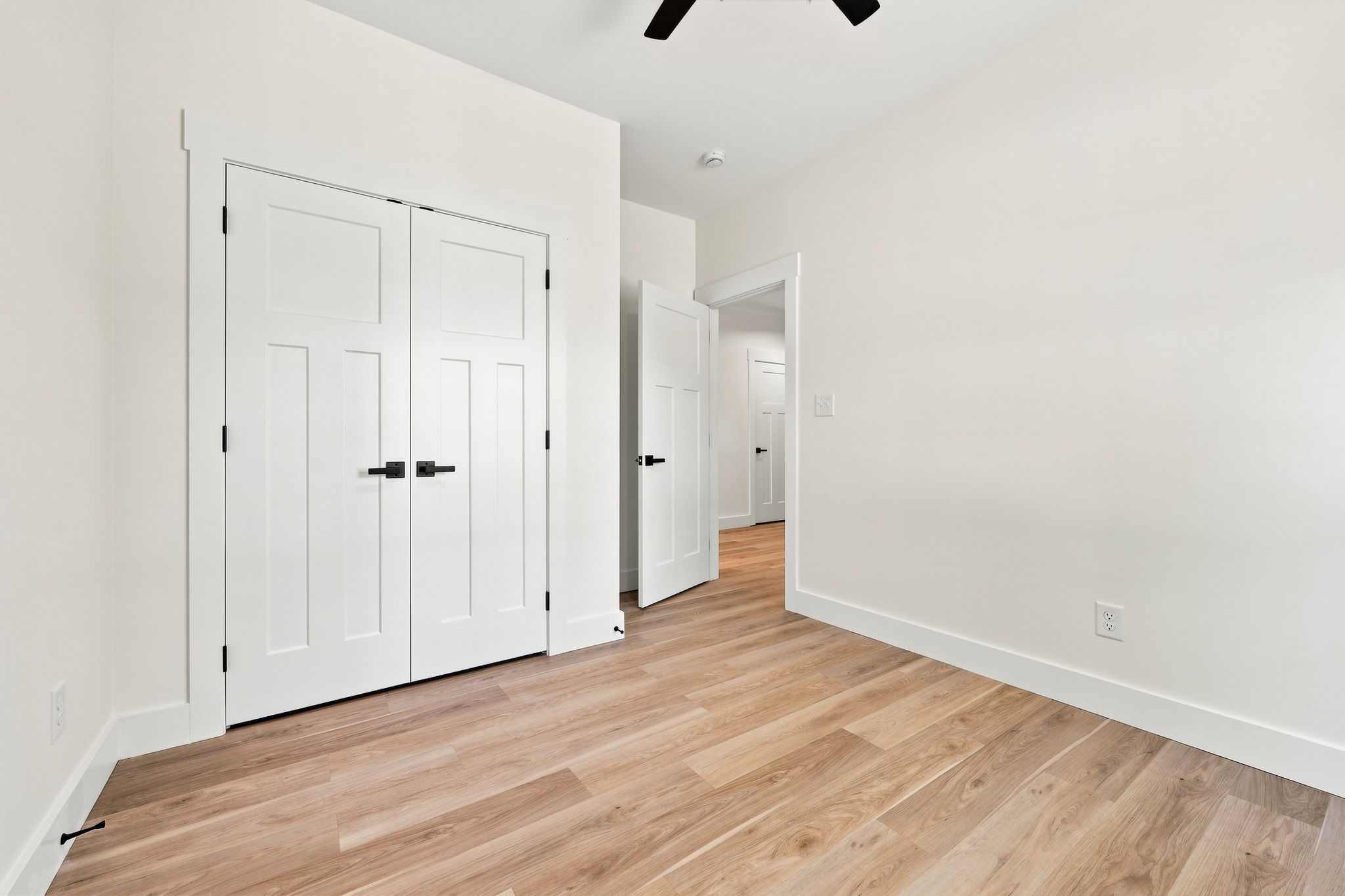 Bedroom with Dual-Door Closet at The Eliora by Covenant Construction Group