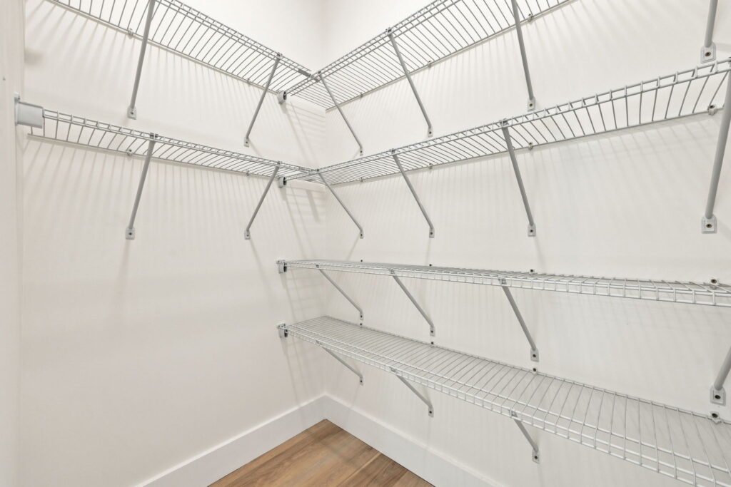 Walk-In Pantry — Floor-to-ceiling shelves beside the kitchen