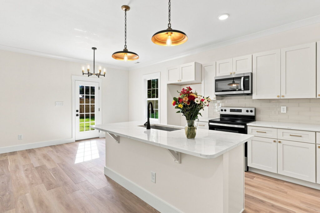 Quartz Kitchen Island — A large work surface and seating overhang anchor the kitchen