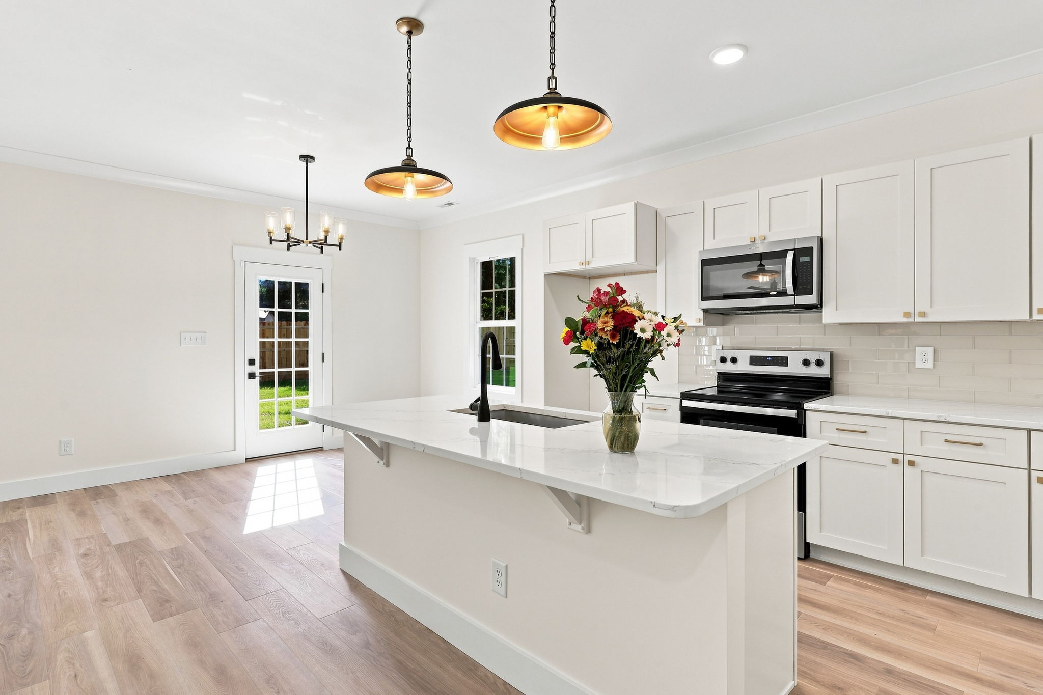 Oversized Kitchen Island at The Eliora by Covenant Construction Group