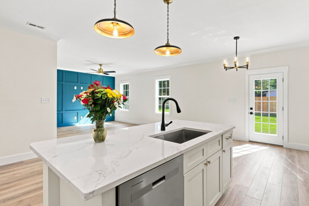 Sink & Dishwasher — The sink, dishwasher, and storage share one hardworking island